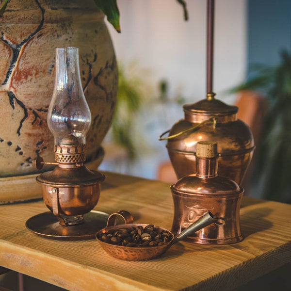 Image showcasing Antique Brass items such as an Oil Lamp, Coffee Seed Bowl & Brass Storage Utensils