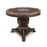 Angled View of Round Carved Wooden Mother of Pearl Inlaid Table Showcasing Exquisite Carvings